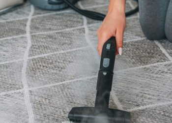 woman-cleaning-carpet-with-steam-cleaner