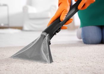 woman-cleaning-carpet-with-vacuum-cleaner